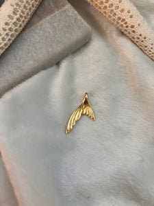 Golden tail charm