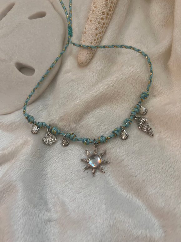 Silver sun charm necklace