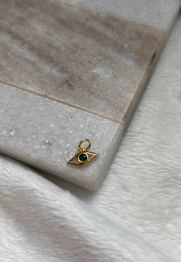 Tiny green eye charm