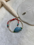 Fish and pearls bracelet